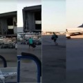 Un pasajero de Ryanair corre por la pista tras perder su avión en el aeropuerto de Barajas