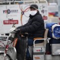 Pekín en alerta roja por contaminación, cierra fábricas y escuelas